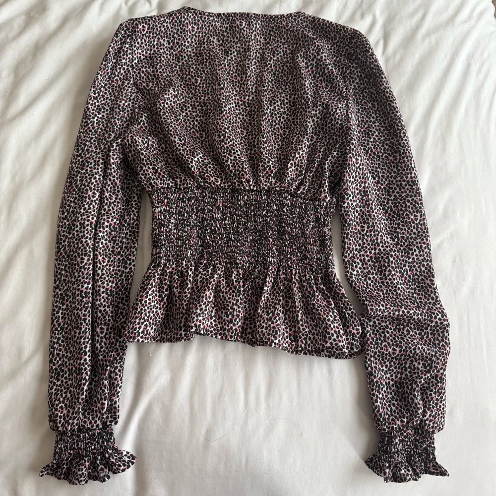 Cheetah Print Peplum Long Sleeve Blouse - Picture 8 of 10